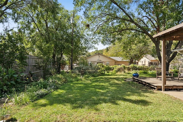 view of yard featuring a wooden deck