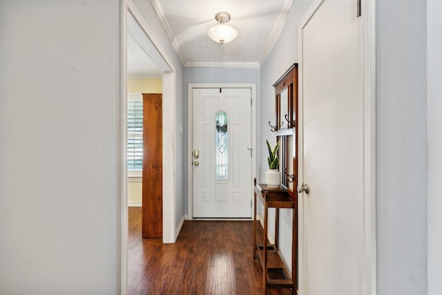 entrance foyer featuring ornamental molding and dark hardwood / wood-style flooring