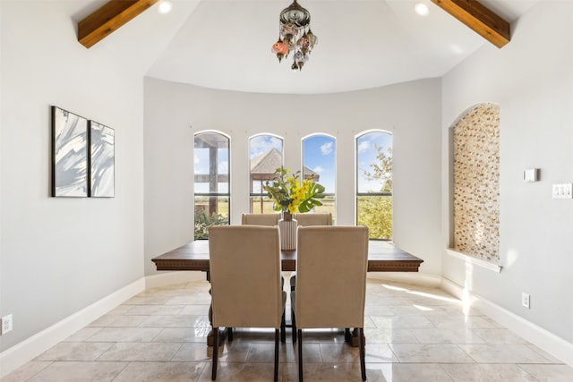 tiled dining area with vaulted ceiling with beams