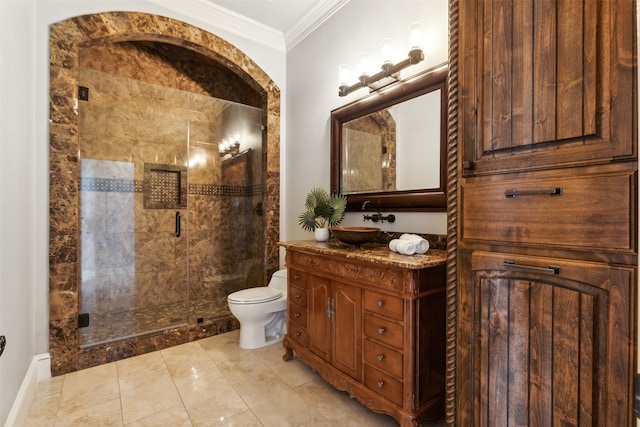 bathroom with vanity, toilet, a shower with door, and crown molding