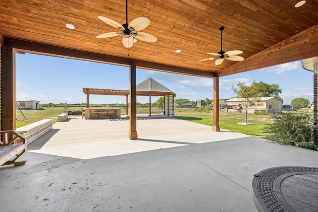 view of patio with a hot tub and ceiling fan