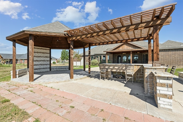 view of patio featuring a pergola and a bar