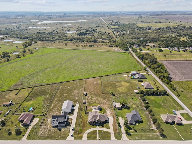 birds eye view of property with a rural view