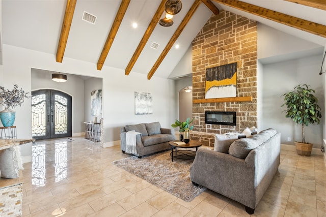 living room with french doors, high vaulted ceiling, a stone fireplace, and beam ceiling