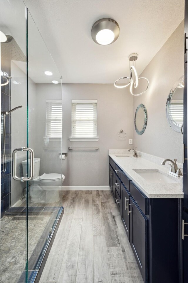 bathroom featuring a shower with shower door and crown molding