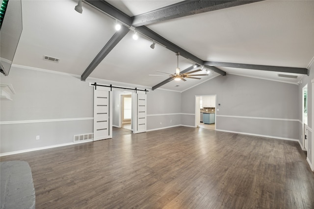 unfurnished living room featuring a barn door, lofted ceiling with beams, ceiling fan, and dark wood-type flooring