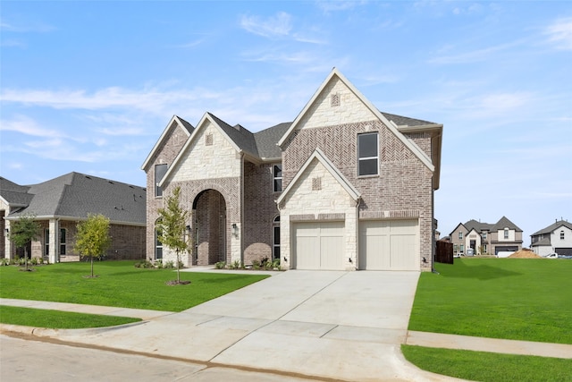 view of front facade with a garage and a front lawn