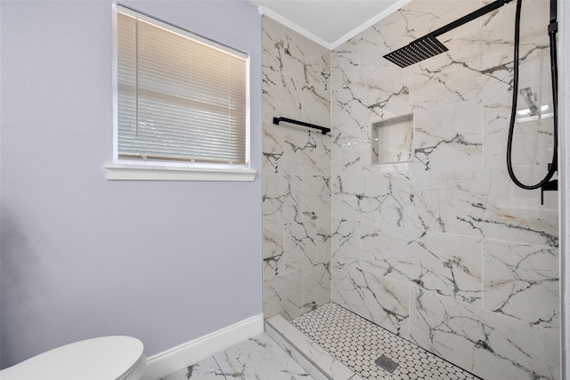 bathroom with a tile shower, crown molding, and toilet