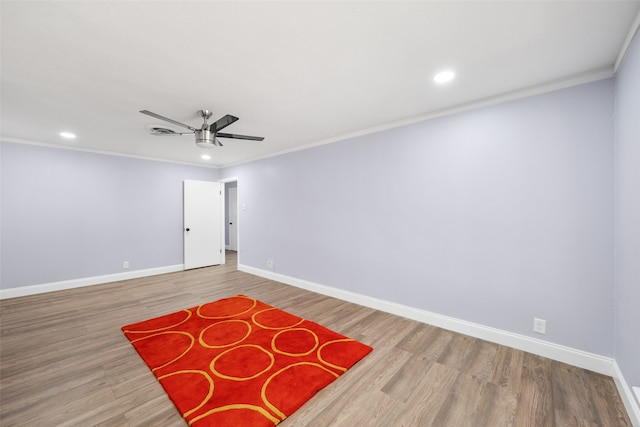 spare room with ornamental molding, ceiling fan, and hardwood / wood-style floors