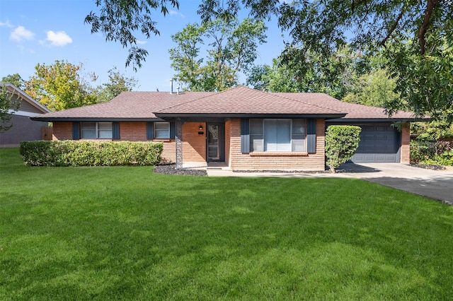 single story home featuring a garage and a front yard