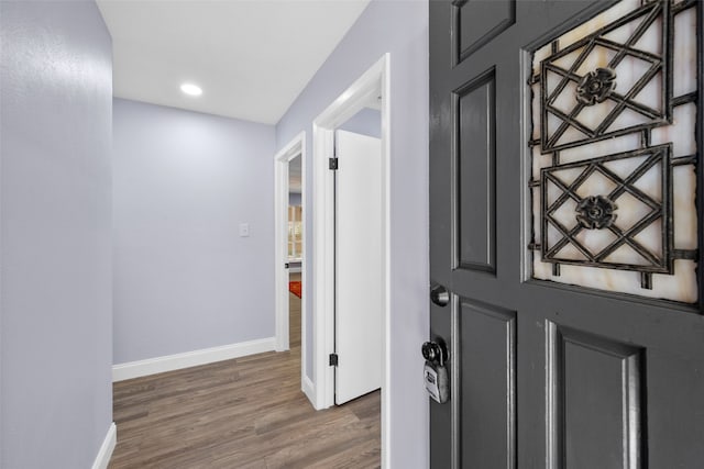 foyer entrance with dark hardwood / wood-style floors