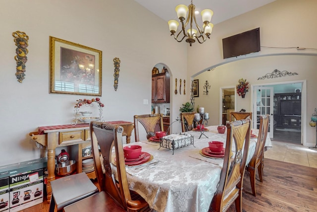 dining room featuring light hardwood / wood-style flooring and a chandelier