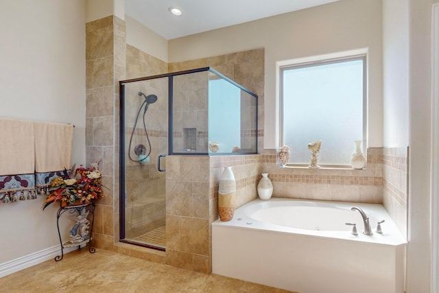 bathroom with shower with separate bathtub