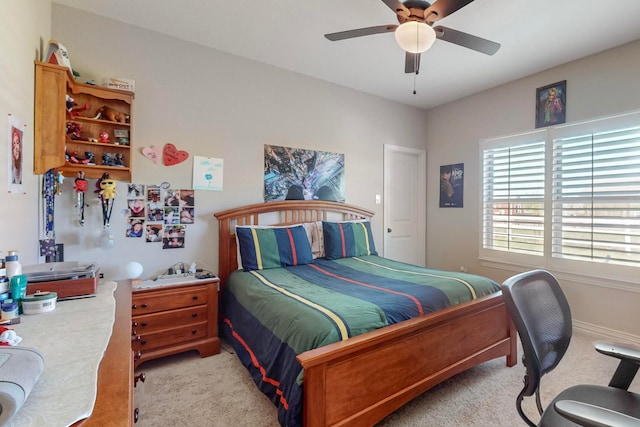 bedroom with ceiling fan and light carpet