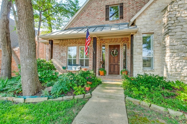 doorway to property featuring a porch