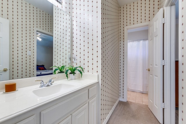 bathroom featuring vanity and curtained shower