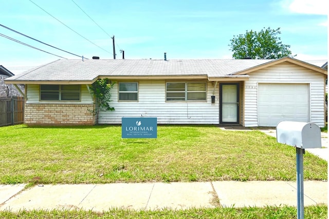 single story home with a front lawn and a garage