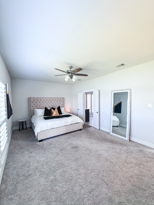 bedroom featuring ceiling fan and carpet flooring