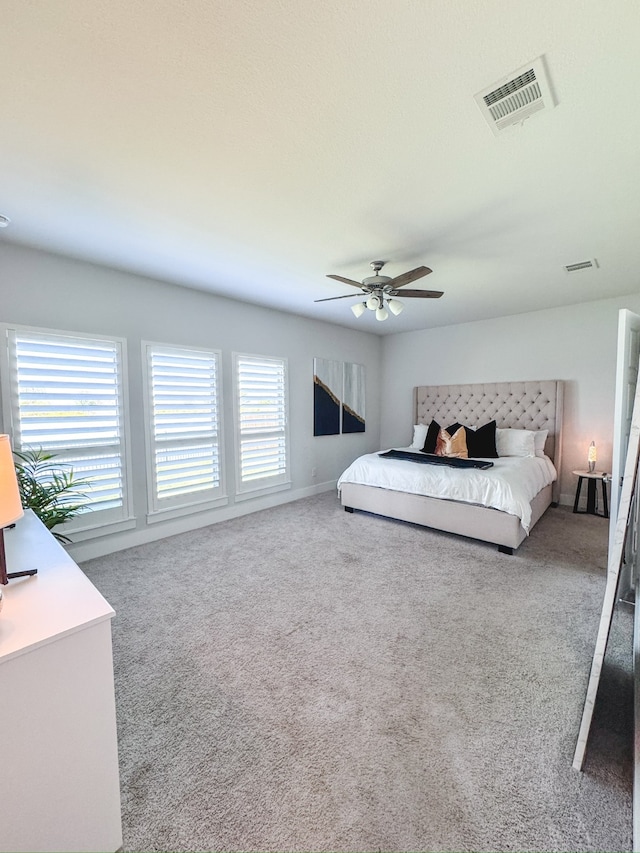 carpeted bedroom featuring ceiling fan