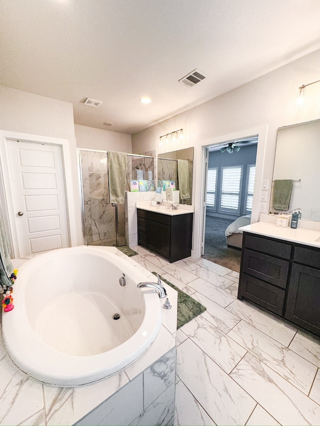 bathroom with vanity, independent shower and bath, and ceiling fan