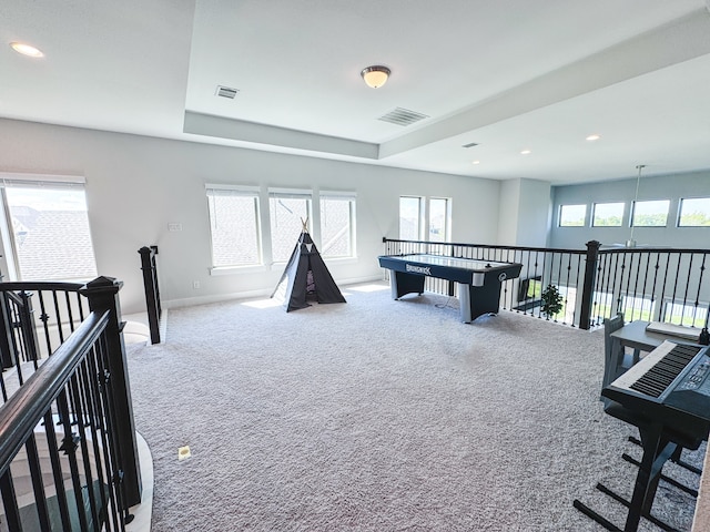 recreation room with carpet floors and plenty of natural light