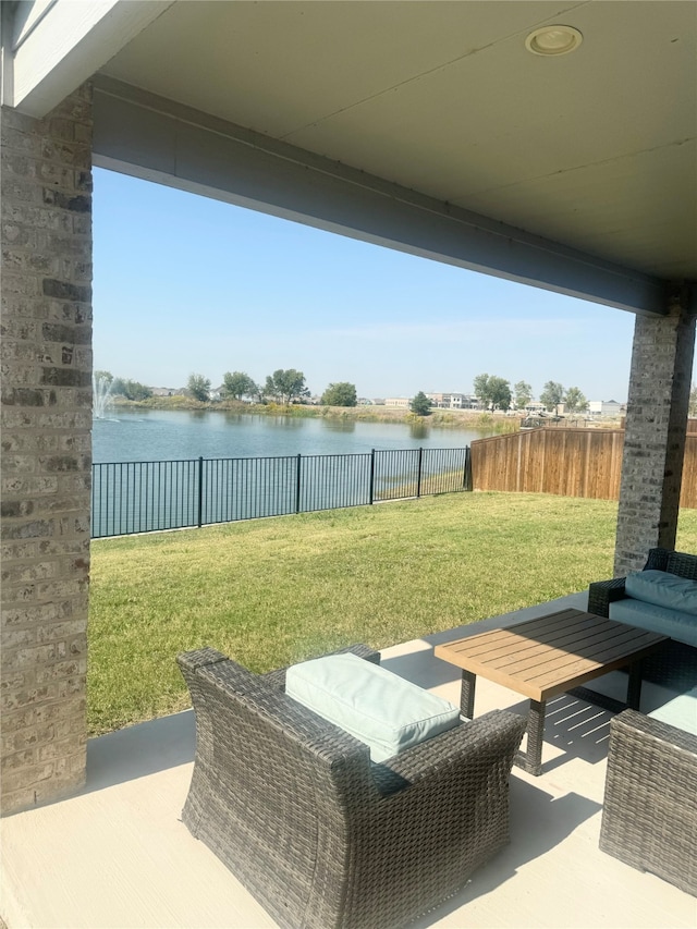 view of patio featuring a water view