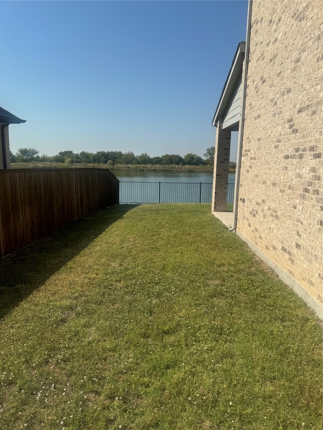 view of yard with a water view