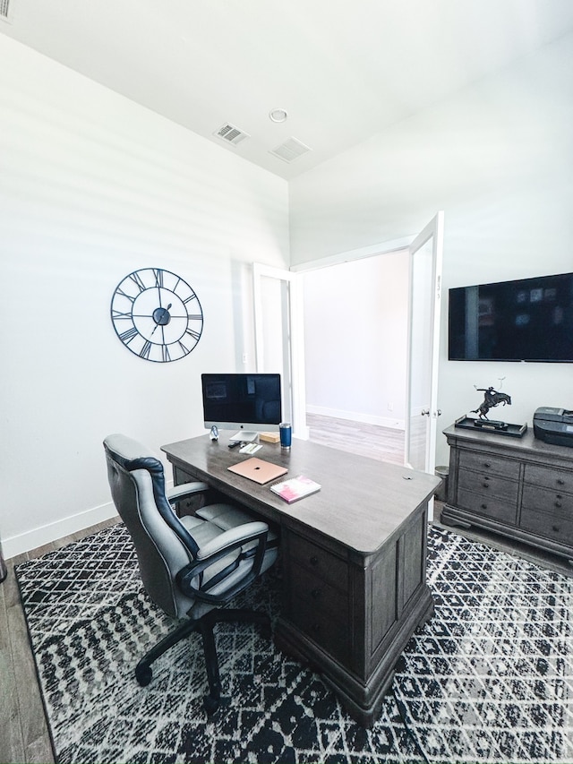 home office featuring dark hardwood / wood-style flooring