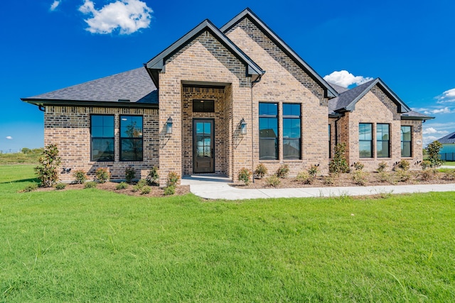 craftsman inspired home with a front lawn