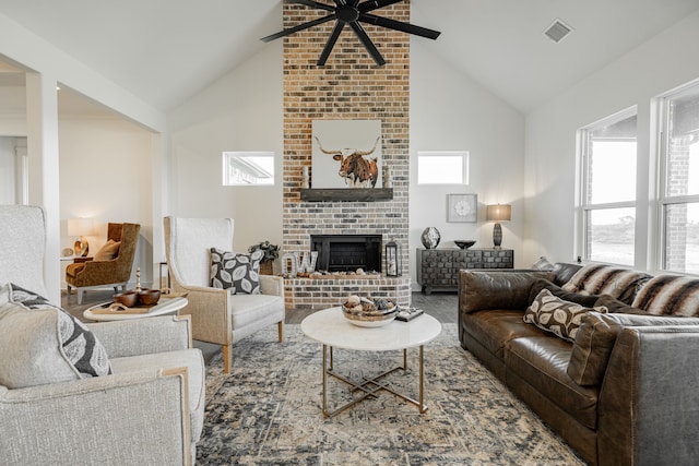 living room with ceiling fan, a fireplace, and high vaulted ceiling