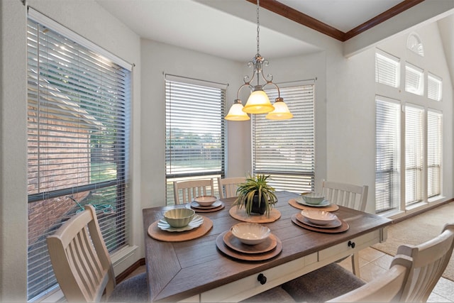 tiled dining room featuring an inviting chandelier, crown molding, and a wealth of natural light