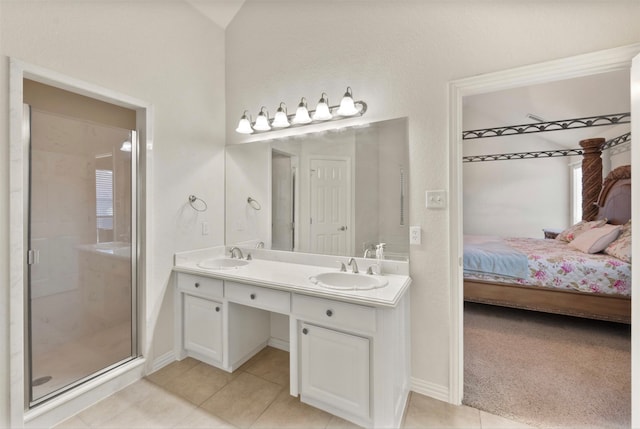 bathroom featuring vanity, tile patterned floors, and an enclosed shower