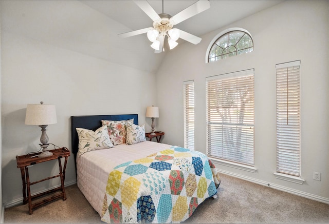 carpeted bedroom featuring ceiling fan and vaulted ceiling