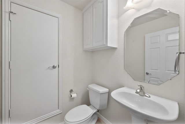 bathroom with sink and toilet