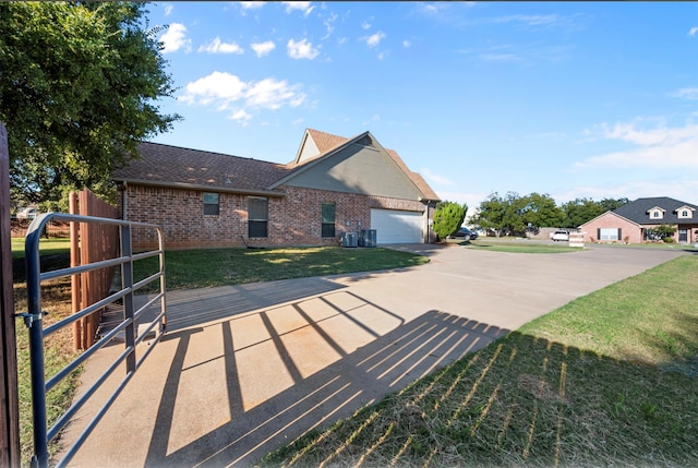 view of front of home with a garage and a front lawn