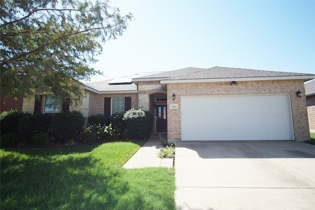 view of front of house with a front lawn and a garage