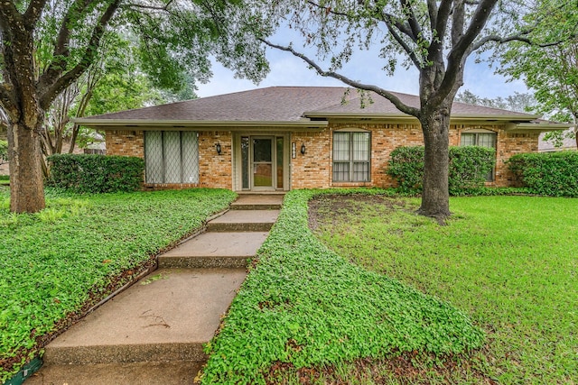 ranch-style house with a front lawn