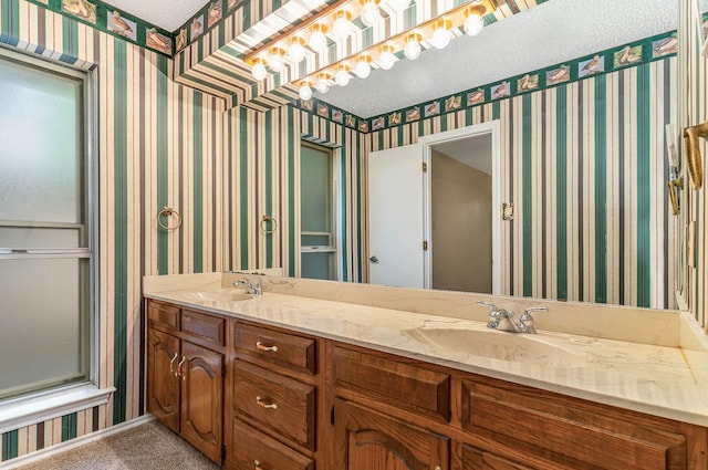 bathroom with vanity and a textured ceiling