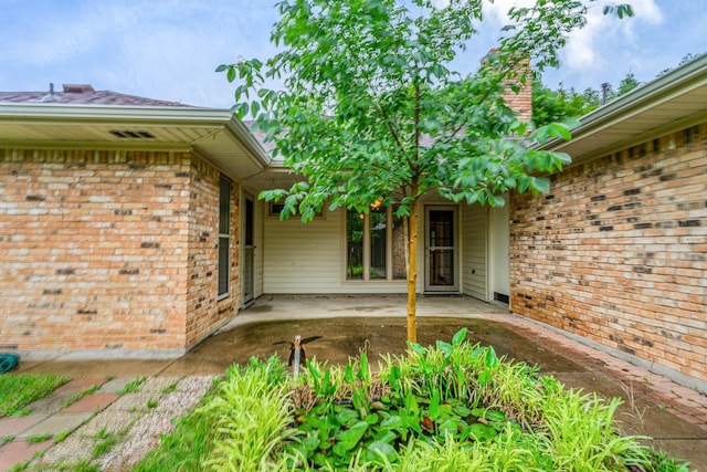 doorway to property featuring a patio area