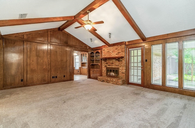 unfurnished living room with light colored carpet and a healthy amount of sunlight