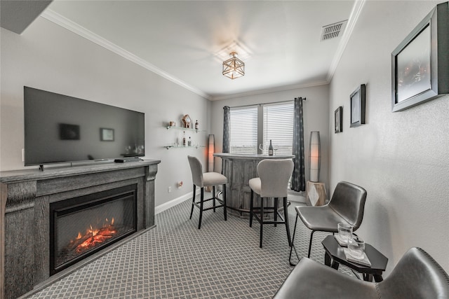 carpeted dining area featuring indoor bar and ornamental molding