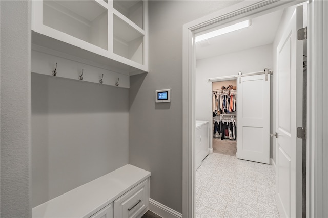 mudroom featuring a barn door