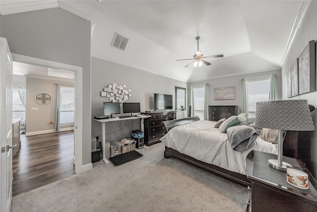 bedroom featuring vaulted ceiling, visible vents, and ornamental molding