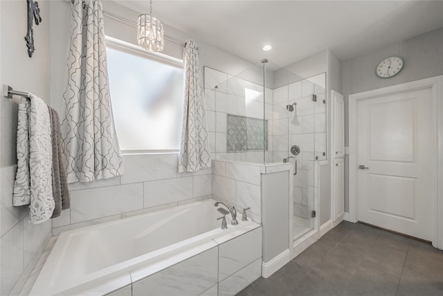 bathroom featuring independent shower and bath and tile patterned flooring