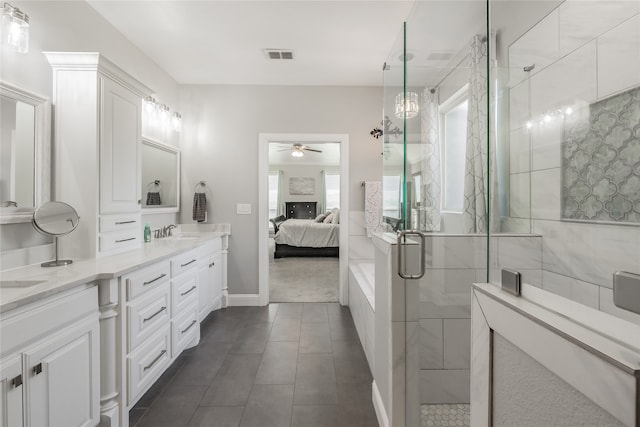 bathroom with an enclosed shower, vanity, ceiling fan, and tile patterned floors