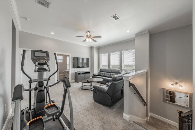 living room with ornamental molding, light colored carpet, and ceiling fan