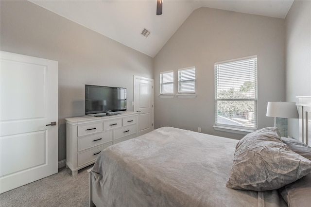 bedroom featuring ceiling fan, visible vents, high vaulted ceiling, and light carpet