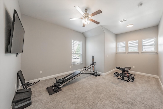 exercise room featuring baseboards, a ceiling fan, visible vents, and carpet flooring