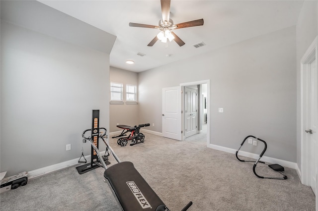 workout area with ceiling fan, baseboards, visible vents, and carpet flooring