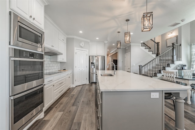 kitchen featuring a large island and white cabinets